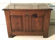 an old wooden cabinet sitting on the floor