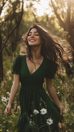 Vintage-inspired woman in a flowy green dress, surrounded by wildflowers, soft sunlight filtering through trees, joyful expression, wind in her hair, ultra-realistic photography, natural colors. Boho Chic