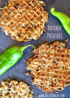 three different types of fried potatoes on a baking sheet with peppers and seasonings around them