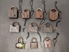 there are many old padlocks and keys on the floor next to each other