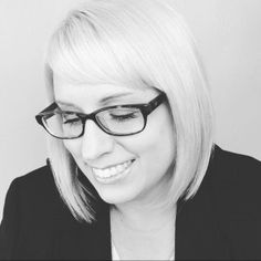 black and white photograph of a woman wearing glasses