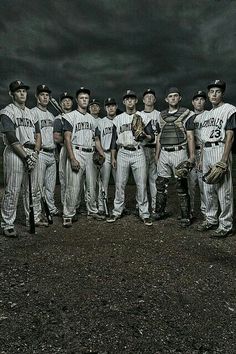 a group of baseball players standing next to each other