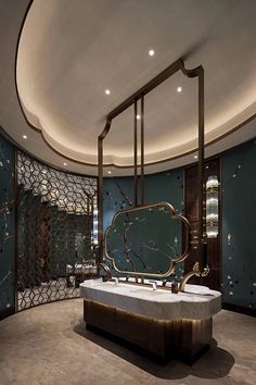 a fancy bathroom with marble and gold accents