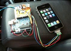 an iphone is hooked up to a microcondule and connected to a circuit board