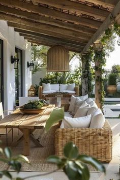 an outdoor living area with wicker furniture