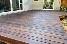 a wooden deck in front of a house