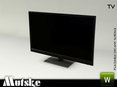 a computer monitor sitting on top of a white table next to a green sign that says,