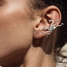 🐙In mythology, Eros, who has an octopus head, is the incarnation of the love of the gods. After the spirit of Eros is incorporated into the personality, we can get absolute freedom. The octopus is also a representative creature of the kraken in Norse sagas. This ear clip is unique and rich in meaning. 🖤 Octopus Head, Silver Ear Cuffs, The Kraken, The Octopus, Silver Ear Cuff, Ear Cuffs, Kraken, Octopus, Ear Cuff