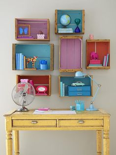 a yellow desk topped with lots of drawers