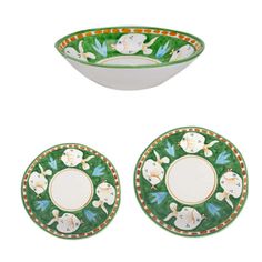 two green and white plates with animals on them, one has an empty bowl in the middle