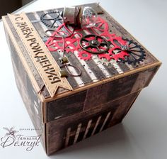 a wooden box with gears and words on it