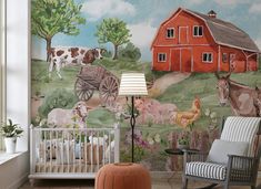 a baby's room with farm animals painted on the wall and a rocking chair