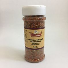 a jar filled with spices sitting on top of a white table