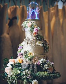 a three tiered wedding cake decorated with flowers