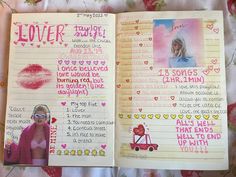 an open notebook with pink writing and pictures on the pages, along with other items