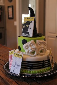 a cake decorated with halloween decorations on a table