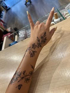 Tattoo + nails = perfect combination❤️ Tattoos With Deep Meaning For Black Women, Cute Outline Tattoos For Women, Tiger Lily Vine Tattoo, Hand Tattoos Wrap Around, Arm Sleeve With Small Tattoos, Floral Wrap Around Tattoo Forearm Color, Hibiscus Flower Back Tattoos, Unique Flower Tattoos For Women, Thigh Tats For Women Meaningful