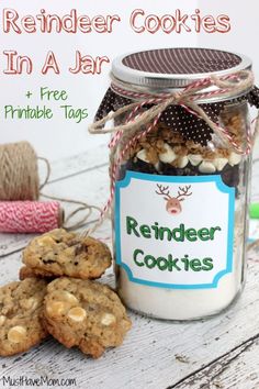 a jar filled with cookies next to a pile of yarn