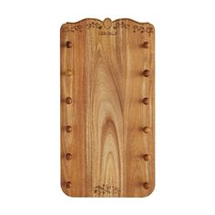 a wooden cutting board with holes in the middle and two handles on each side,