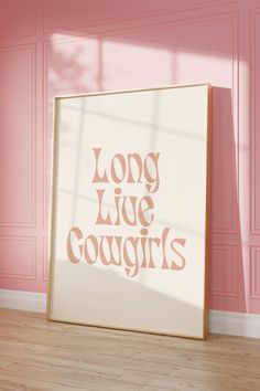 a pink wall with the words long live cougars on it in front of a white frame