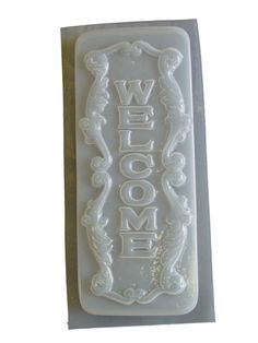 a welcome sign is shown on a plastic tray