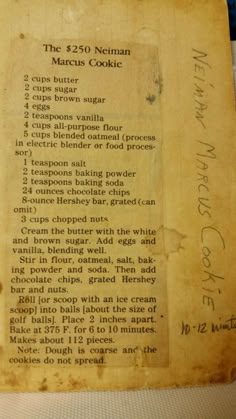 an old recipe book with some writing on the front and back cover that says, the 350 neiman marcus cookie