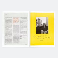 an open book with a yellow cover and black writing on the page, in which two people are sitting