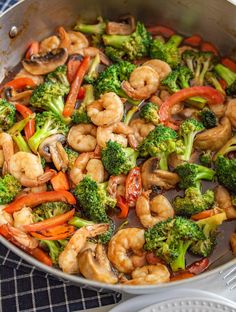 shrimp and broccoli stir fry in a wok