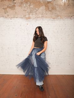 Our Yvonne Tulle Skirt is the ultimate statement piece for layering! With its high-rise elastic waistband and sheer, layered tulle, this midi skirt adds a dreamy touch to any outfit. Pair it with a fitted top and heels for a standout evening look, or wear it over jeans for an edgy daytime vibe. Details High Rise Pull-On Style Elastic Waistband Sheer Layered Tulle Midi Length Size recs: 0-4 Small, 4-6 Medium, 8-10 Large Provides lots of stretch Spring Sheer Stretch Skirt, Chic Tiered Sheer Skirt, Chic Sheer Tiered Skirt, Tulle Skirt Dress For Fall, Fall Tulle Dress With Flowy Skirt, Flowy Tulle Skirt Dress For Fall, Summer Tulle Maxi Flared Skirt, Chic Tulle Lined Maxi Skirt, Flared Tulle Maxi Skirt With Lining