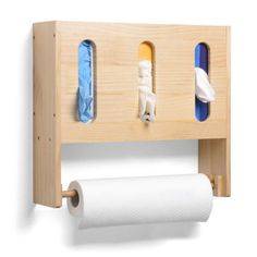 a wooden shelf with two rolls of toilet paper hanging from it's sides and another roll of toilet paper on the other side