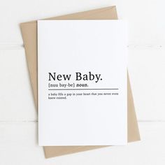 a card with the words new baby in black and white on it's front