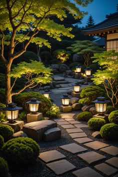 a garden with stone walkway and lit lanterns