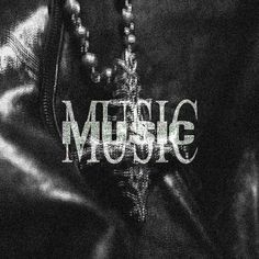 a black and white photo with the word music written on it's back side