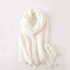 This Cotton Linen Light Scarf is the perfect accessory for adding a pop of color and elegance to any outfit. It's soft, lightweight, and versatile, so you can wear it as a traditional scarf in the cold seasons, wrap it sarong-style for a beach day or just use it with a styling purpose. Available in three stunning colors, pink, ivory and watermelon-red, it's a must-have for any wardrobe that loves to wow. Material: lightweight cotton Size: 35inches X 72inches