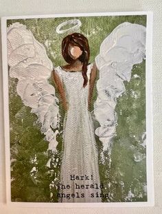 an angel with white wings is shown on a card that says, heart the herald angels sing