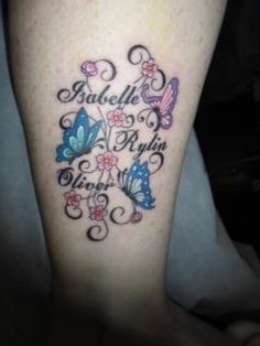 a woman's leg with butterflies on it and the words smile at me written in cursive writing