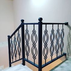 an iron railing in the corner of a room