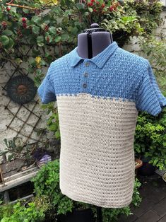 a crocheted polo shirt sitting on top of a mannequin