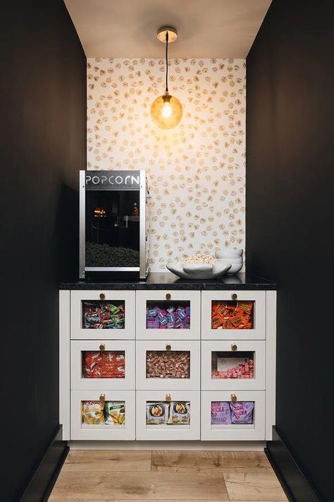 Modern movie room features custom glass front snack drawers under a popcorn machine. Home Theater Snack Bar Ideas, Movie Room Snack Bar, Movie Room Snack Bar Ideas, Home Theater Snack Bar, Modern Movie Room, Movie Game Room, Laundry Basement, Family Basement, Home Theater Game Room