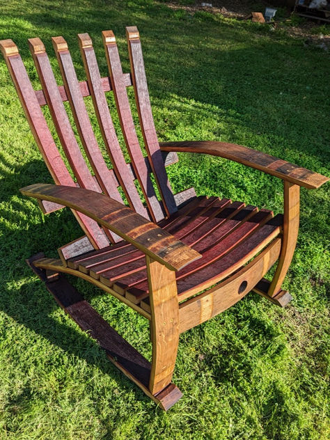 Our chairs are crafted using recycled French oak wine barrels from California's wineries. Each barrel stave is purposefully chosen to build a comfortable & functional piece of art that you will enjoy for years to come.  All staves are sanded prior to assembly to ensure a smooth and finished product.   Size of assembled chair about: 36 in tall x 35 in long x 29 in wide  Check out our store link for more details! https://timber2art.etsy.com/listing/1495273285/wine-barrel-rocking-adirondack-chair Adirondack Rocking Chair, California Winery, Barrel Stave, Wine Barrels, Wine Barrel, French Oak, Lazy Susan, Adirondack Chair, Rocking Chair