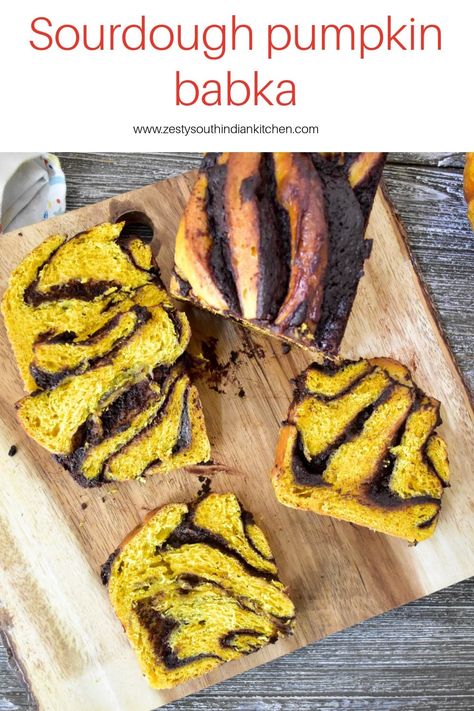 Delicious sourdough pumpkin babka made with sourdough starter, pumpkin puree spiced up with pumpkin pie spice and filled with chocolate filling. #pumpkinsourdoughbread #sourdoughbead #pumpkinrecipes Pumpkin Babka, Sourdough Babka, Sourdough Pumpkin, South Indian Kitchen, Japanese Milk Bread, Braided Bread, Homemade Pumpkin Puree, Easy Cinnamon, Indian Kitchen