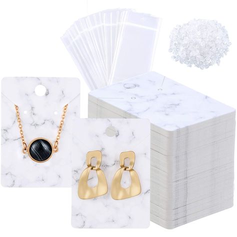 PRICES MAY VARY. Nice combination: the package comes with 200 pieces marble jewelry display cards, 200 pieces self-sealing bags and 400 pieces earring backings, 800 pieces in total, which will be your practical accessories Proper size: the display cards are designed with marble-themed, the size of the earring necklace card is approx. 2 x 2.8 inch/ 5 x 7 cm, the self-sealing bag size is approx. 4.7 x 2.4 inch/ 12 x 6 cm, fits most jewelry Reliable to use: these earring display cards are made of d Kraft Paper Tags, Marble Necklace, Jewelry Display Cards, Earring Display Stands, Marble Jewelry, Marble Earrings, Packing Jewelry, Necklace Display, Earring Display