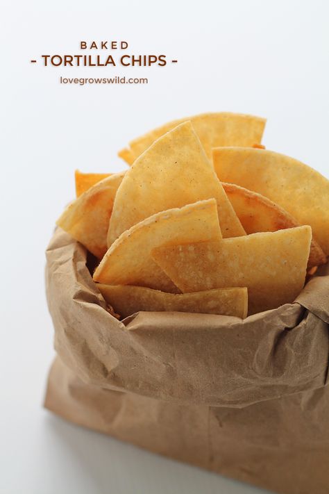 Easy, homemade Baked Tortilla Chips! Perfect for dips, salsa, and guacamole! | LoveGrowsWild.com Chip Recipes, Tortilla Chip Recipe, Baked Tortilla Chips, Healthy Chips, Homemade Chips, Bake Goods, Potato Chip, Dash Diet, Puppy Chow