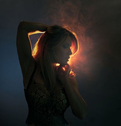 Back light woman dramatic orange smoke fog Photography Back Lighting, Portrait Interesting Lighting, Fun Lighting Ideas Photography, Creative Lighting Portraits, Dramatic Studio Portraits, Light Behind Person, Cool Lighting Portrait, Backlighting Reference, Backlighting Drawing