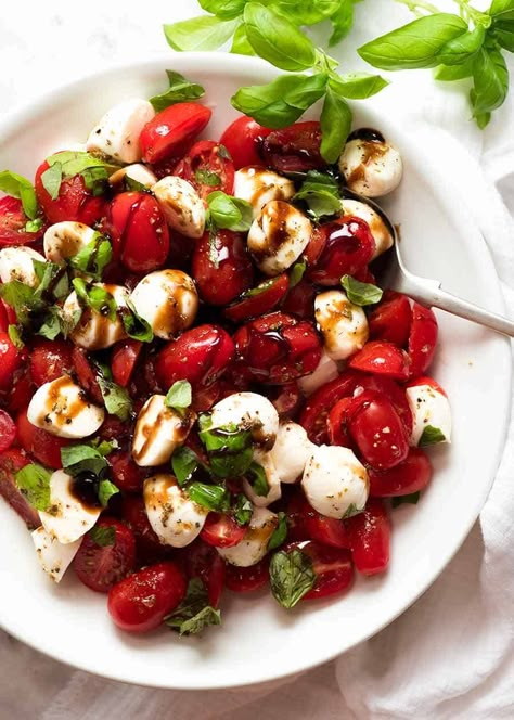 Caprese Salad with cherry tomatoes, baby mozzarella / bocconcini, basil leaves and dressed with a garlic-herb Caprese Salad dressing and drizzled with balsamic glaze ~ Recipe Tin Eats Caprese Salad Dressing, Salad Caprese, Balsamic Glaze Recipes, Tomato Caprese, Caprese Salad Recipe, Resep Salad, Recipetin Eats, Recipe Tin, Salad Pasta