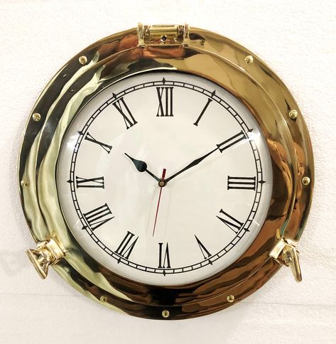 PRICES MAY VARY. Overall Diameter : 15" | Display Diameter : 9.50" (Approx) SKU Code - B07KM93628 | Material - Solid Brass + Glass | Working Porthole Which Opens And Closes. Excellent Hinged Wall Decor For Any Nautical Or Pirate Theme Decor | Hand Finished Some Imperfections Possible | Realistic Nautical Decor - Modeled After An Antique 19th-Century Ship's Porthole Gifts Ideas & Perfect Memorable Navy Gifts For Birthdays, Anniversary Of Marines, Retired Navy Officer, Sea-Sailors, Seafarers Etc | Ship Porthole, Nautical Wall Clock, Lobby Decor, Clock Home Decor, Navy Gifts, Ship Decor, Nautical Wall Decor, Hanging Clock, Analog Clock