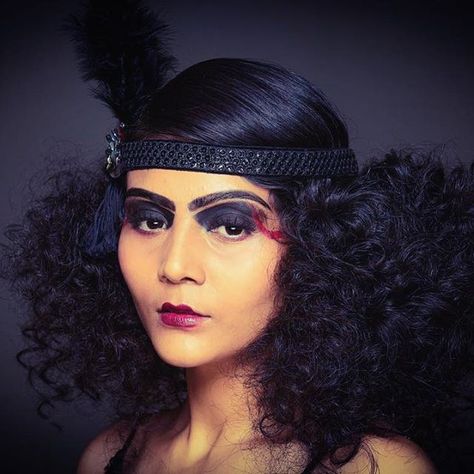 Totally for the hair!!   Top 100 frizzy hair photos Loved shooting this 1920's inspired MODERN GOTHIC look  Model: @shruti_maheshwari  Hair: @fatmupromakeup  Makeup & Styling: @shreya_roy  #1920s #modern #gothic #frizzyhair #fashion #makeup #styling #shoot #beauty #colour See more http://wumann.com/top-100-frizzy-hair-photos/ Great Gatsby Curly Hairstyles, 1920s Curly Hair, 1920s Hair Black Women, Gothic 1920s, 1920s Halloween Costume, Hairstyles 1920, Halloween Destinations, 20s Hair, 1920s Halloween