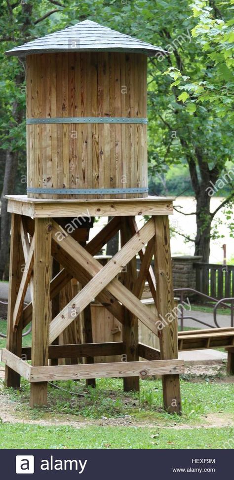 Download this stock image: A small wooden water tower. - HEXF9M from Alamy's library of millions of high resolution stock photos, illustrations and vectors. Diy Waterhouse Holder, Diy Water Tower Decor, Diy Water Tower How To Build, Backyard Water Tower, Wooden Water Tower, Water Tower Diy, Diy Water Tower, Windmill Water Pump, Rain Water Collection Diy