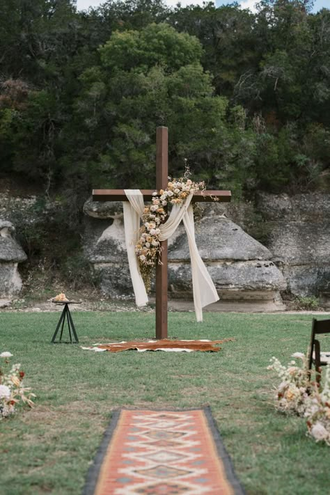 Ranch marriage ceremony- #Ranch #Wedding Check more at https://howcandothis.com/weddingideas/ranch-marriage-ceremony/ Western Wedding Arbor Ideas, Cross Decor For Wedding, Wooden Cross Wedding Arch, Wedding Cross Altar Diy, Flower Stands For Wedding Ceremony, Western Wedding Altar, Outside Ceremony Ideas, Cross Wedding Arbor, Simple Western Wedding Decor