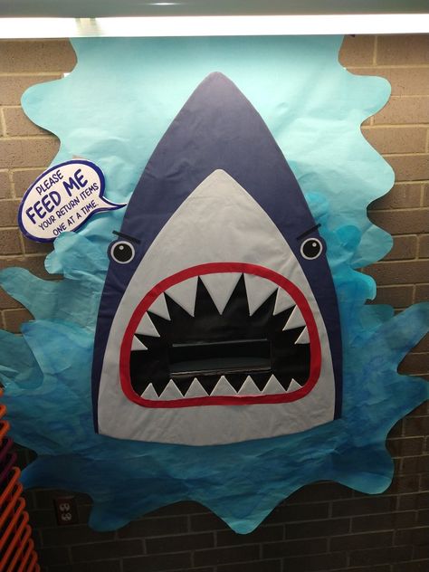 Ocean Book Fair Theme, Library Ocean Theme, Shark Bulletin Board Ideas, Library Book Drop Decoration, Under The Sea Book Fair, Book Drop Ideas Library, Shark Bulletin Board, Ocean Library, Ocean Bulletin Board